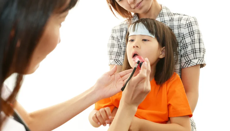 child having physical examination
